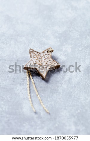 Christmas star on bright wooden background. Close up. Copy space. 