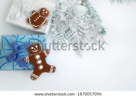 Decorative figure of a gingerbread man on a Christmas background. Decorative Christmas picture with a copy space