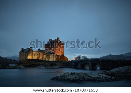 Eilean Donan Castle, Scotland, Uk, Highlands. Night photo with castle lights. Historic castle and famous for its proximity to the Iska de Skye. Cold environment at low tide
