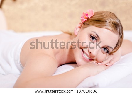 beautiful young blond woman attractive girl spa treatments happy smiling & looking at camera closeup portrait 