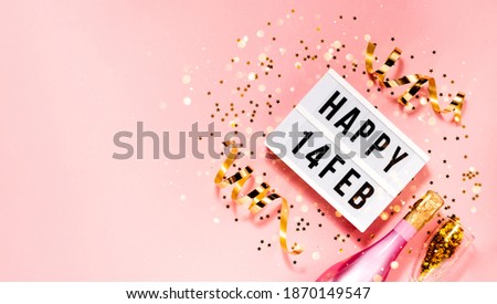 Saint Valentine's day  festive background. Bokeh lights and confetti February 14 . Top horizontal view copyspace. Royalty-Free Stock Photo #1870149547