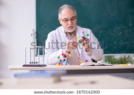 Experienced old scientist working in the lab Royalty-Free Stock Photo #1870162000