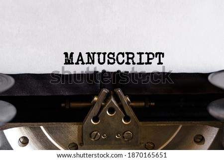Vintage typewriter with printed text - MANUSCRIPT Royalty-Free Stock Photo #1870165651