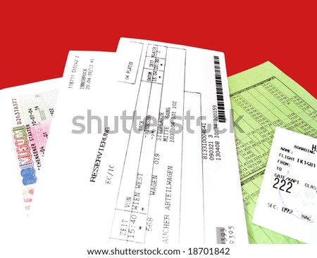 airplane tickets and travel documents on red background