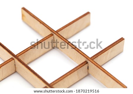 Sharp wooden sign isolated on white background. Close-up