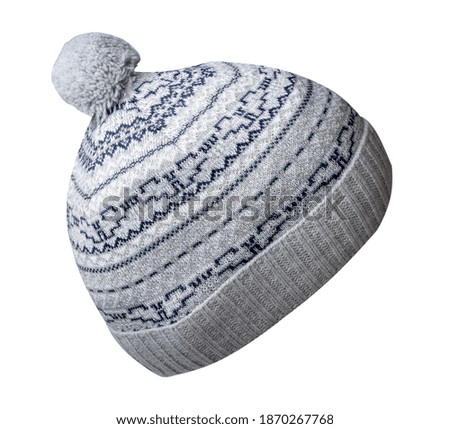   knitted gray dark blue hat isolated on white background.hat with pompon .
