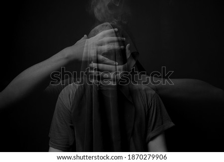 dark surrealism photography concept portrait of man with hand cover the face in dark background, double exposure photography