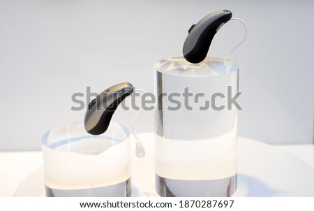 Modern Hearing aid devices. Closeup Royalty-Free Stock Photo #1870287697