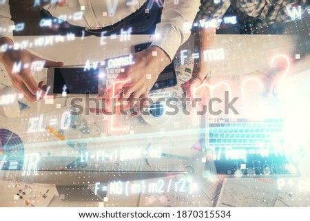 Double exposure of man and woman working together and formula hologram drawing. Computer background. Top View. Education concept.
