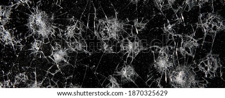 cracks on black glass background, broken abstract glass hole destruction concept