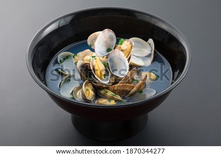 sake steamed fresh clam clear soup Royalty-Free Stock Photo #1870344277