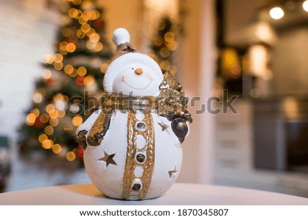 Toy snowman on a table during the holiday season