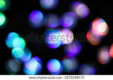 Dark abstract background with blurred lights