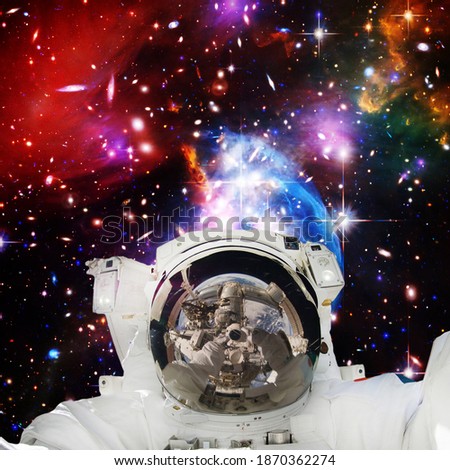 Astronaut and galaxy. The elements of this image furnished by NASA.

