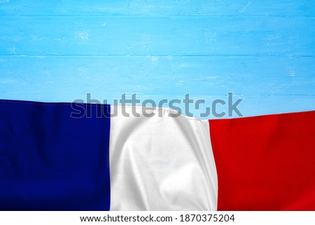 Flag of France on wooden bakground, copy space