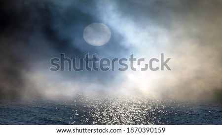 soft focus ,fog at sea blue night starry sky and full moon fluffy clouds ,reflection on sea water ,nature landscape seascape weather forecast 