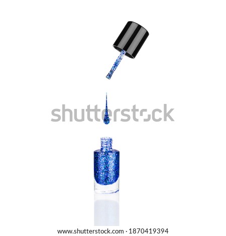 Blue glittering nail polish glass bottle, brush, flowing drop white background isolated close up, opened dark blue sequin varnish, bright shiny lacquer, sparkling enamel, beautiful shimmer gel