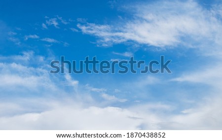 Blue sky with soft white clouds in sunny day. Nature sky background, texture for Design. Wallpaper or Web banner With Copy Space