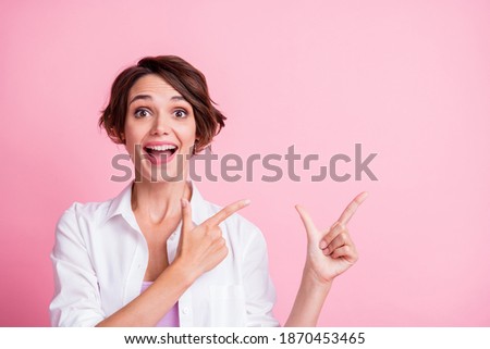 Photo of lovely amazed girl wear white shirt point empty space follow isolated on pastel pink color background