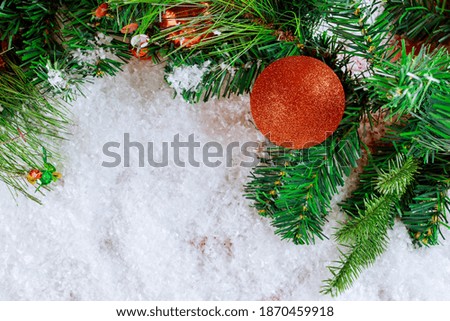 Christmas fir tree snow on branch with pine cone, snowflakes decoration ball