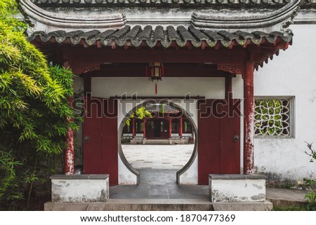 Circular gate to traditional Chinese house on Tiger Hill (Huqiu) in Suzhou, Jiangsu, China