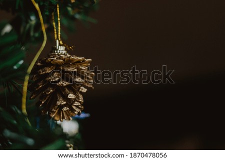 Golden pine cone, Christmas decoration. Christmas background.