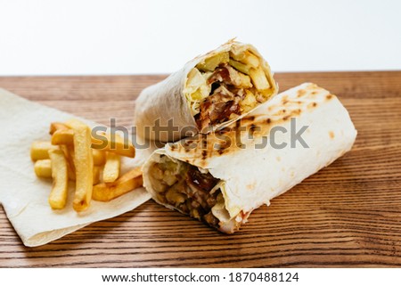 Turkish Shawarma on a wooden Board and light background