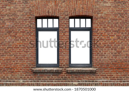 Beautiful old rough brick wall and windows with black frame and isolated white empty space.