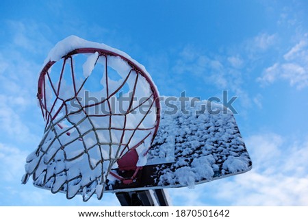 basketball hoop on which it snowed