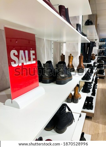 Sale sign in shoe shop. Season sale. Going out of business. 
