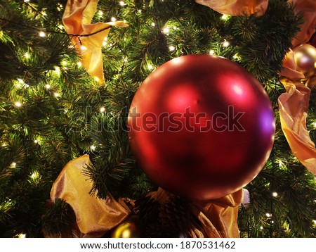 Colored balls and lights decorate the Christmas tree during the Christian New Year.