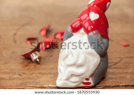 Closeup on Santa holding his hands in front of his eyes