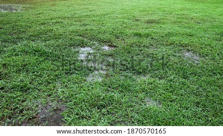 flooded soccer field after heavy rain Royalty-Free Stock Photo #1870570165