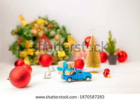 Delivery Christmas gift by Truck on white background, Determined Image for Christmas Holiday and Happy New Year Gift Celebration concept