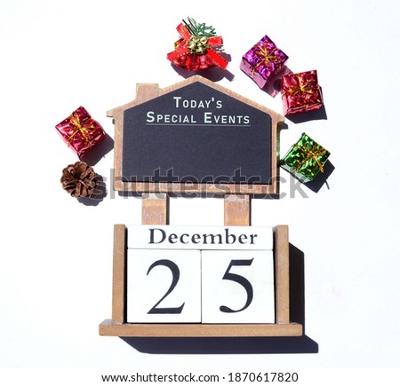 Image with wordings on chalkboard with block and Christmas decorations background