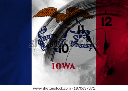 United States of America, America, US, USA, American, Iowa flag with clock close to midnight in the background. Happy New Year concept