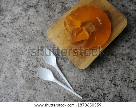 orange-flavored gelatin is delicious served on wooden plate