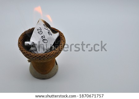 Let's take this 2020 year and set it on fire, so let's hope 2021 will be better. Conceptual photo represented burning a sheet of paper with Bye 2020
