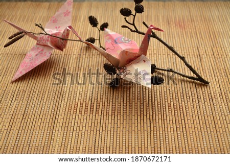 Paper crane origami bird on table objects