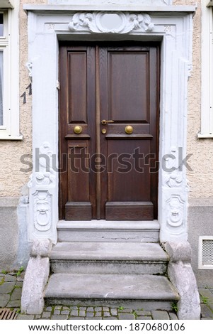 old wooden door entrance to the house, concept of the beginning of a new life, magic portal, medieval European architecture, history of cities