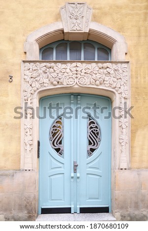 old wooden door entrance to the house, concept of the beginning of a new life, magic portal, medieval European architecture, history of cities