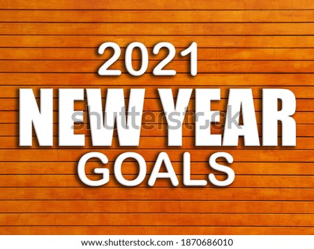 3D Text 2021 New Year Goals on wooden brown table. 3D rendered royalty free stock picture. This image can be used for an online website banner ad or a print postcard