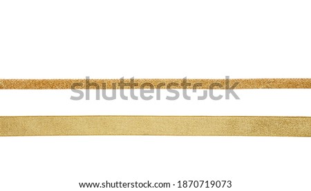 Gold ribbons isolated cutout on white background, shiny bands christmas decoration. Gifts, golden xmas presents concept.