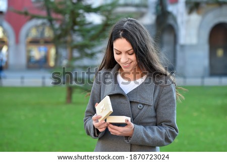 young woman gets a gift box