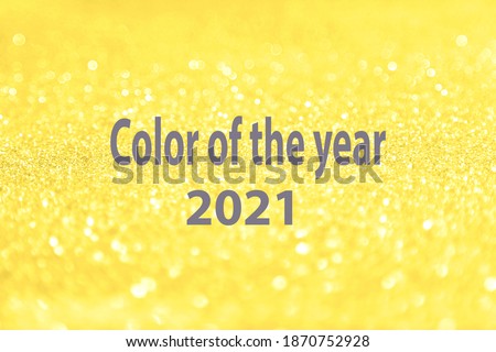 Beautiful festive shine glitter bright glowing yellow, illuminating background blur, radiance, ultimate, grey text "Color of the year 2021" concept fashion, beauty season 2021, design spring, summer.