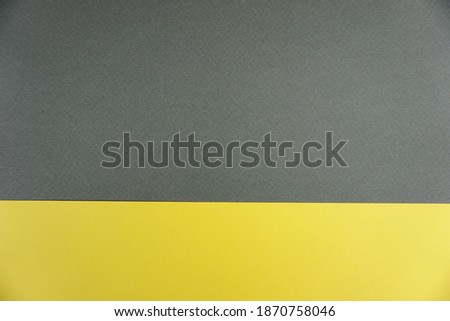 Yellow and gray background with copyspace. Trendy colour.