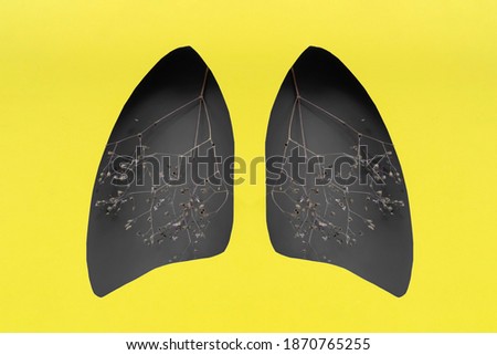 Lungs symbol paper art with dry branches, gray and yellow. World tuberculosis day. Health care, medicine, lung cancer, internal donor organ and stop smoking campaign.