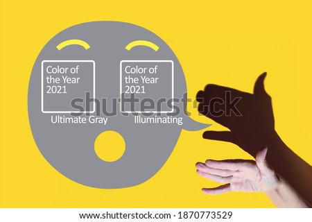 shadow theater. hand shows dog with open a mouth, concept color of the year 2021