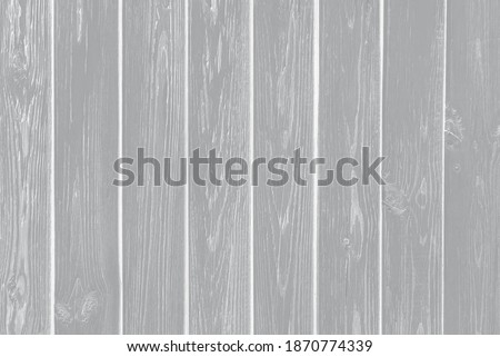 Color of the Year 2021 Ultimate Gray. Old plank wood coral background. Peeling faded red or orange paint on old boards. Copying space