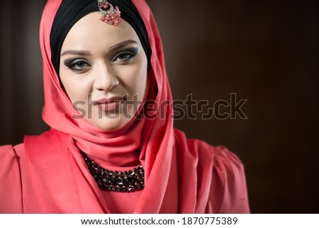 Attractive Woman Making Traditional Prayer to God Allah in the Mosque
